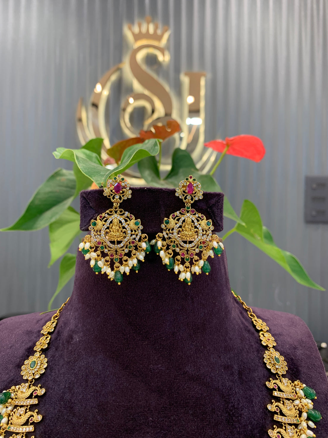 Beautiful cz stone peacock with lakshmi idol design haram and earrings with green beads