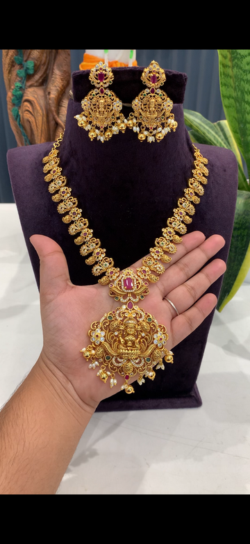 Beautiful peacock and Lakshmi pendant necklace with pushback earrings