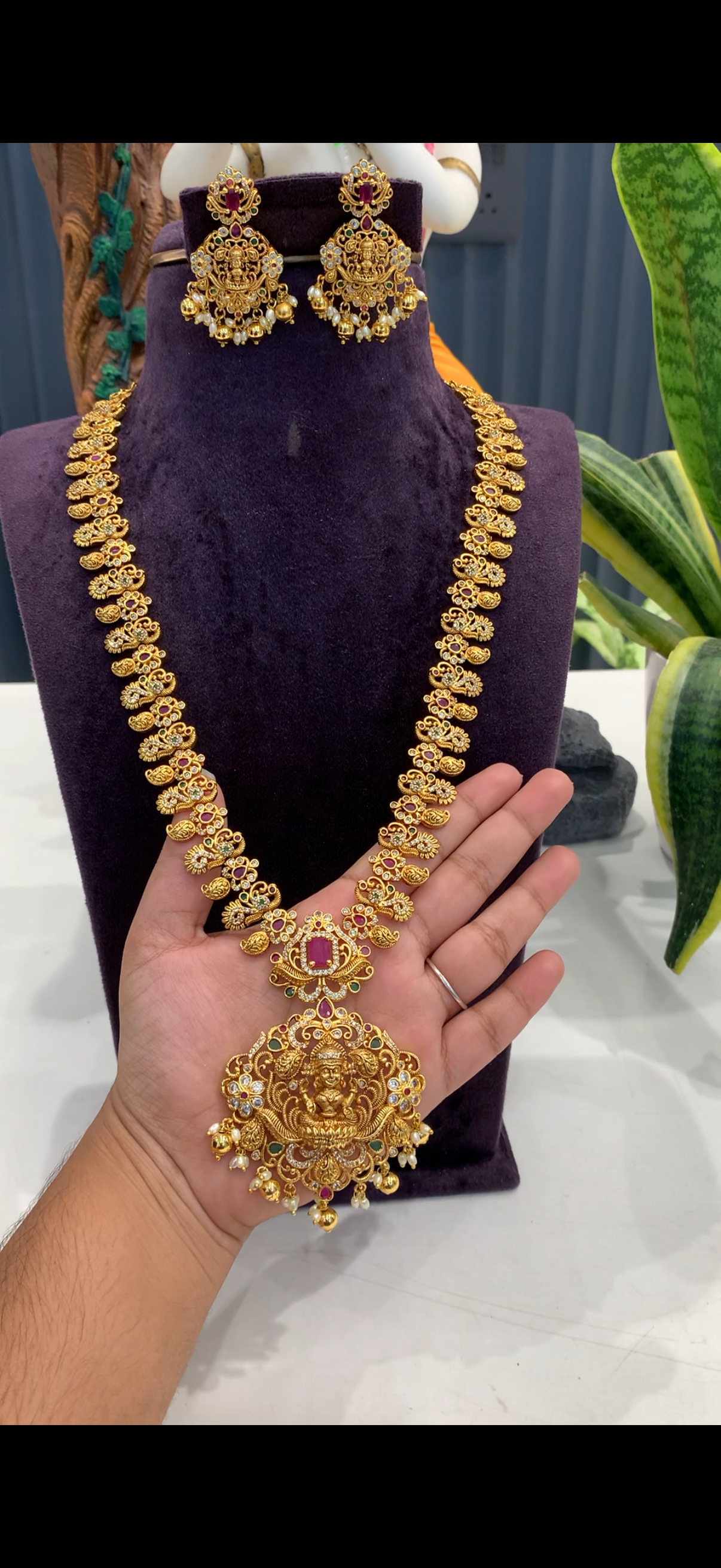 Beautiful peacock design with  lakshmi pendant long haram and pushback earrings