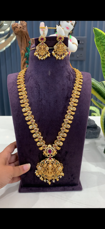Beautiful peacock design with  lakshmi pendant long haram and pushback earrings