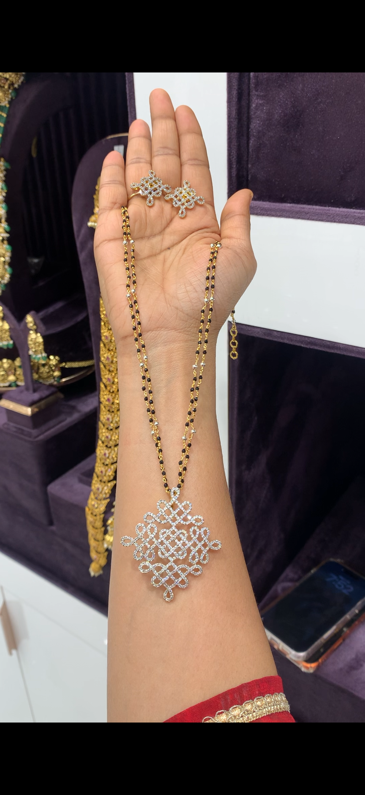 Beautiful muggu design pendant set with black beads chain 18 inchs