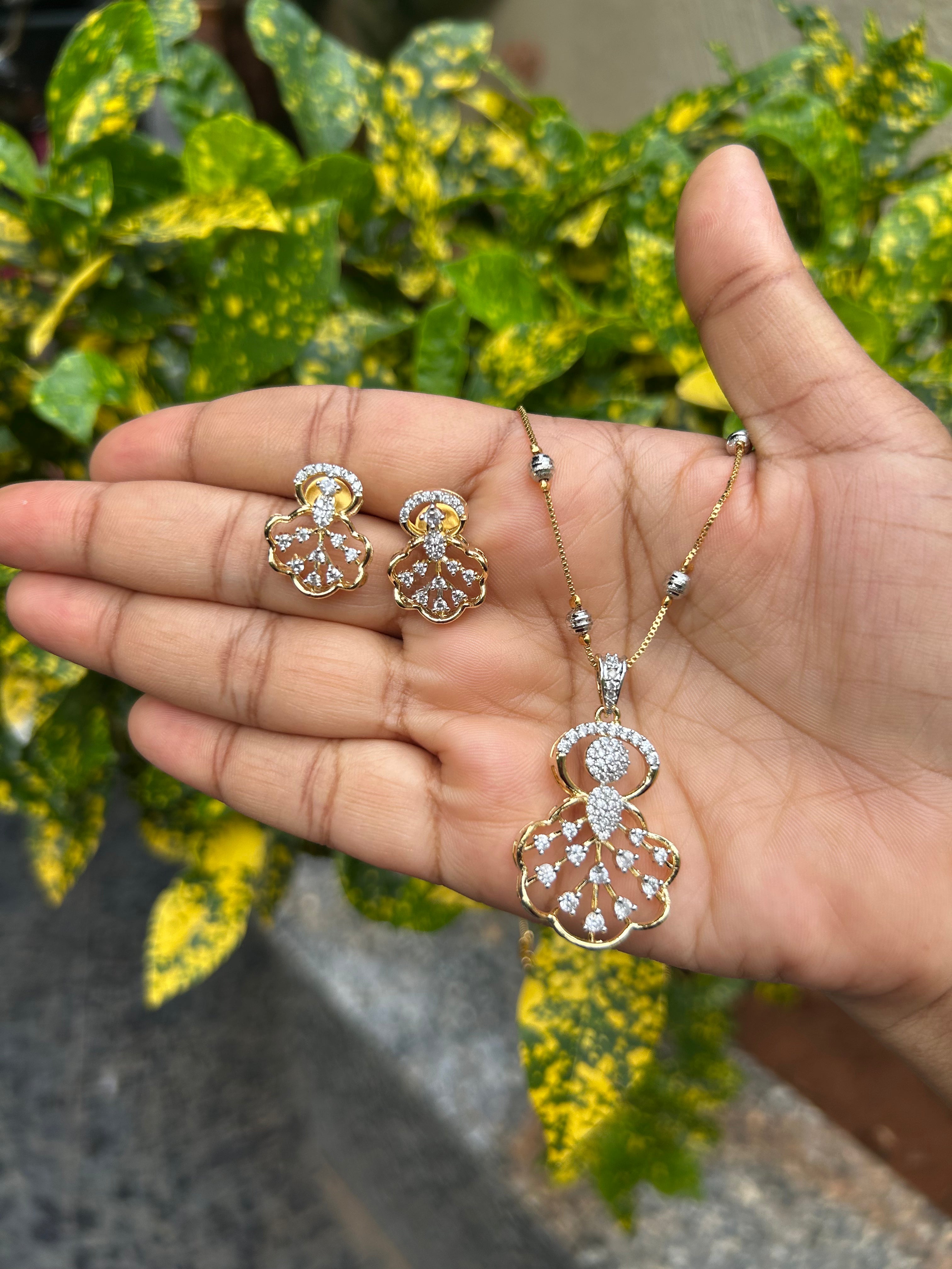 Beautiful white stones pendant set with silver balls chain 18 inchs long