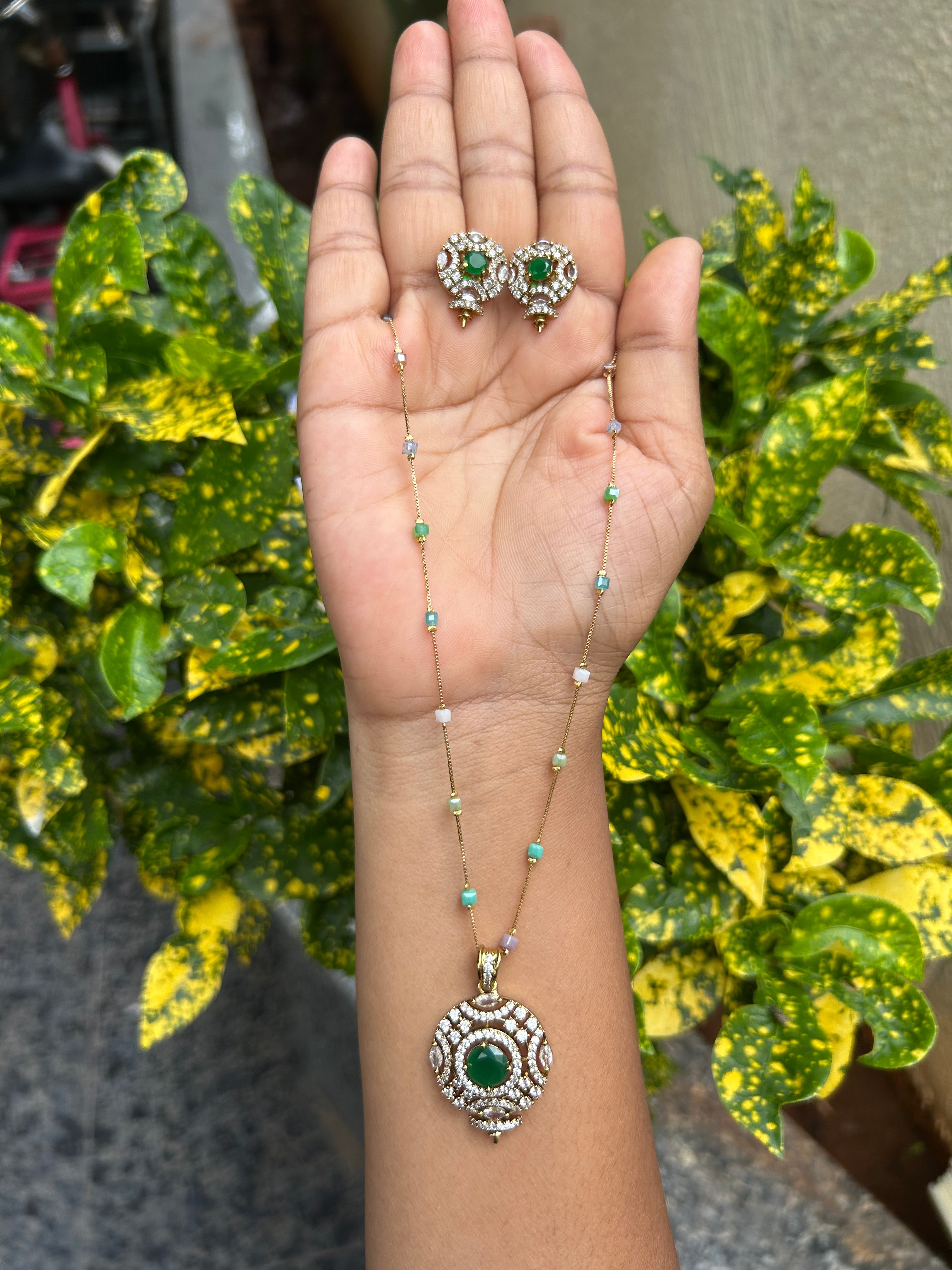 Beautiful green stone pendant set with multi color fancy chain 18 inchs long