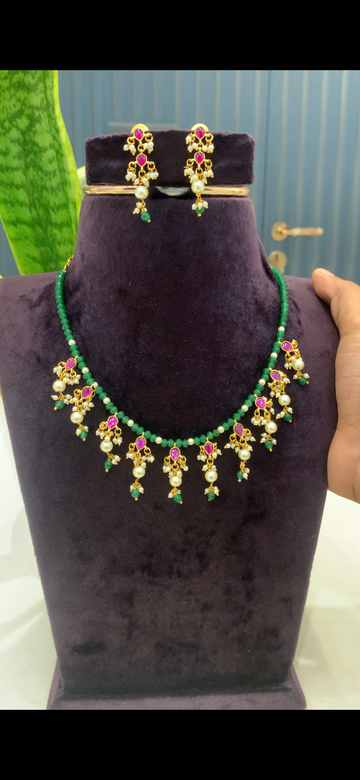 Beautiful green beads chokar with Jadau Kundan dropping lockets