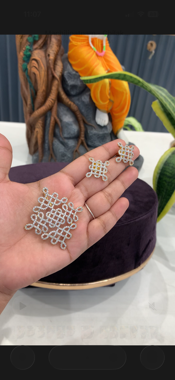 Beautiful muggu design pendant with pushback earrings
