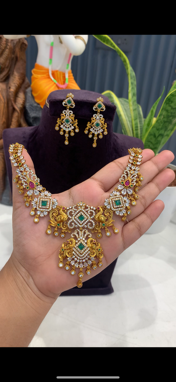 Beautiful white stones and peacock design necklace set with pushback earrings