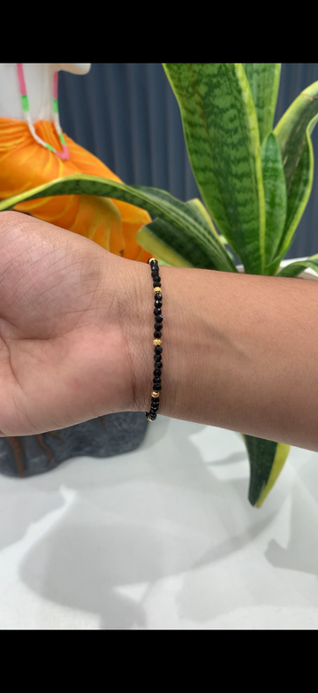 Beautiful black beads and gold balls bracelet with adjustable rings