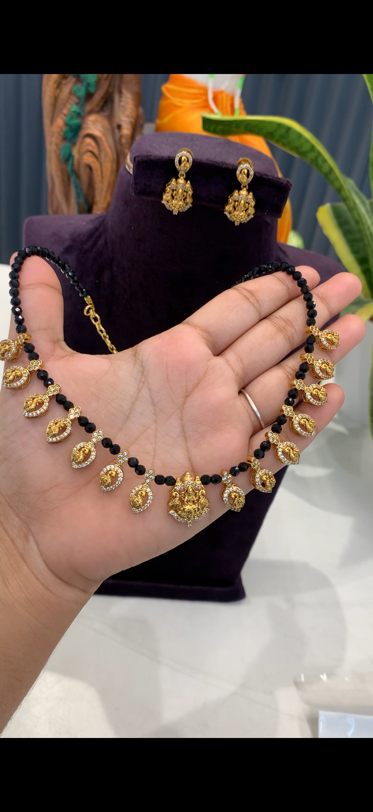 Beautiful black  beads neckset Lakshmi devi and peacock pendants ,with pushback earrings