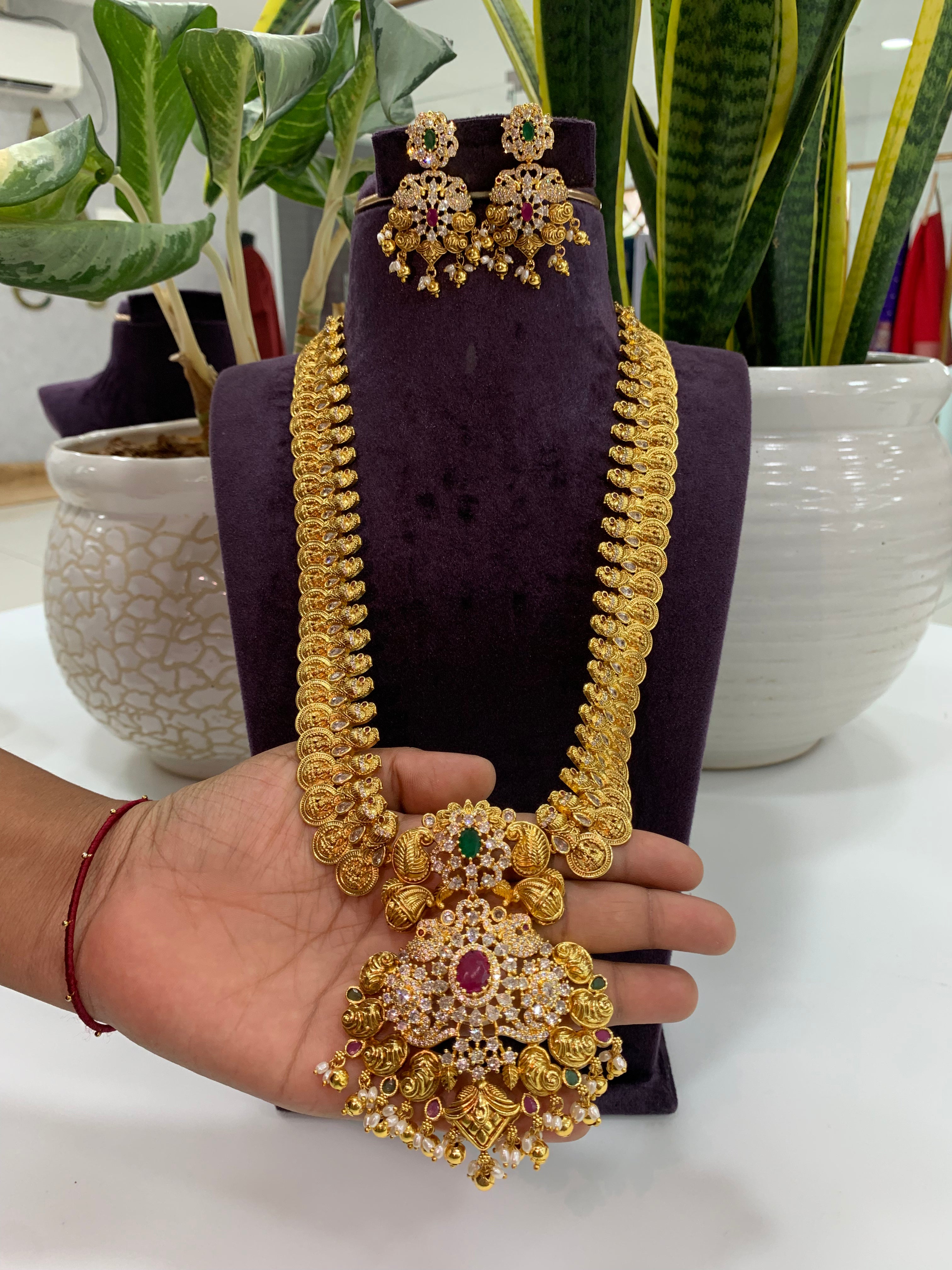 Beautiful white stone and peacock design kasula haram with screwback earrings