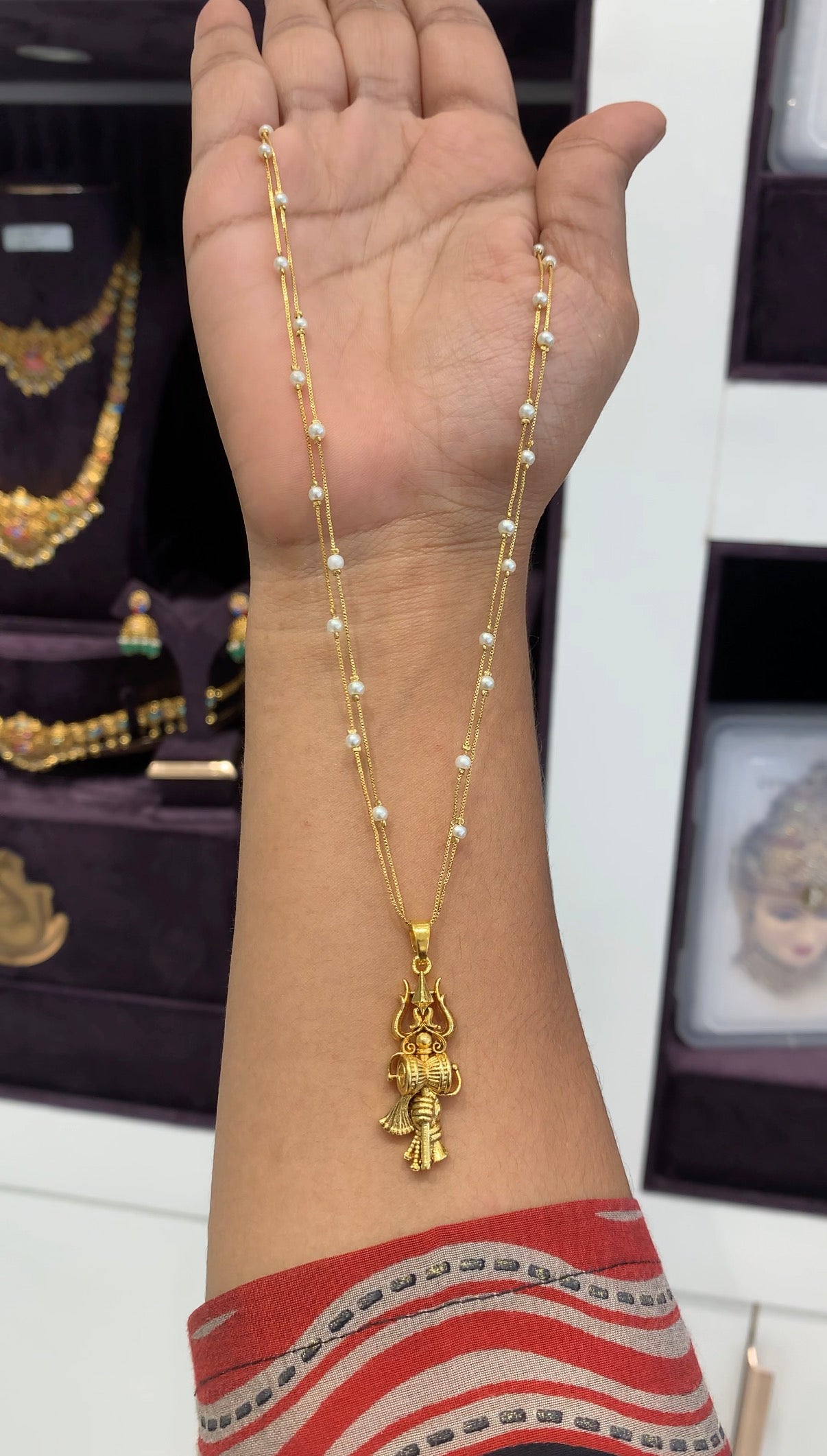 Beautiful thrishulam pendant with white pearls chain 18 inchs long