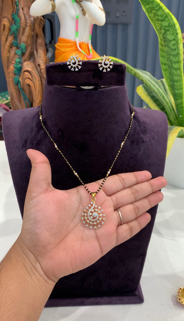 Beautiful white stone pendant set black beads chain 18 inchs long