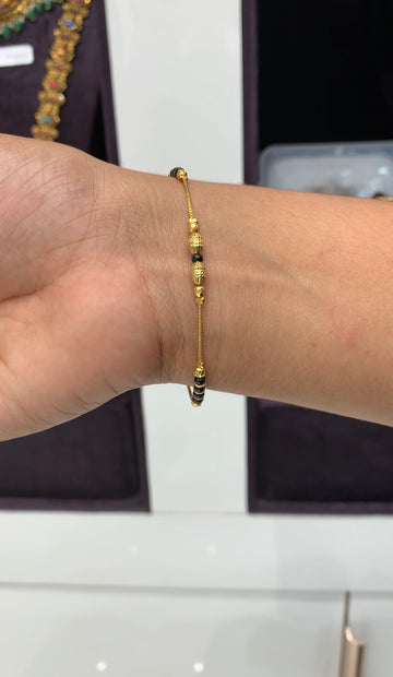 Beautiful gold and Blackbeads bracelet with adjustable rings