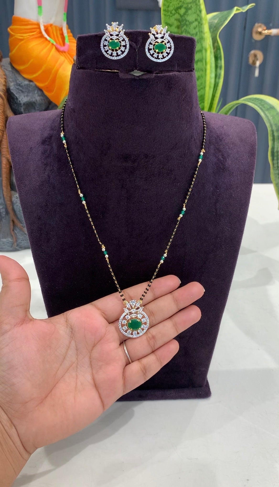 Beautiful green stone pendant set with handmaking black beads chain 18 inchs long