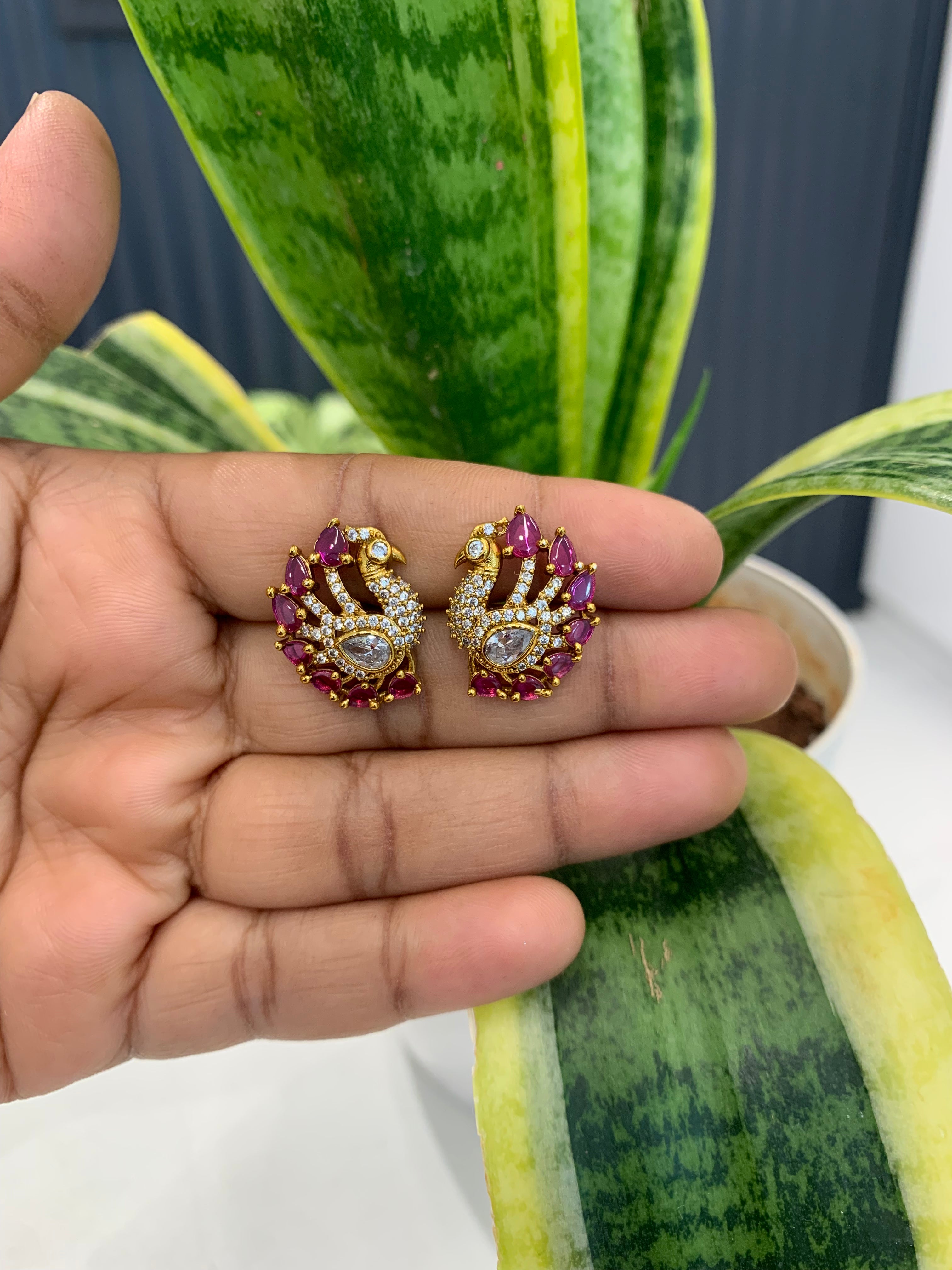 Beautiful peacock design pink & white stone studs with pushback