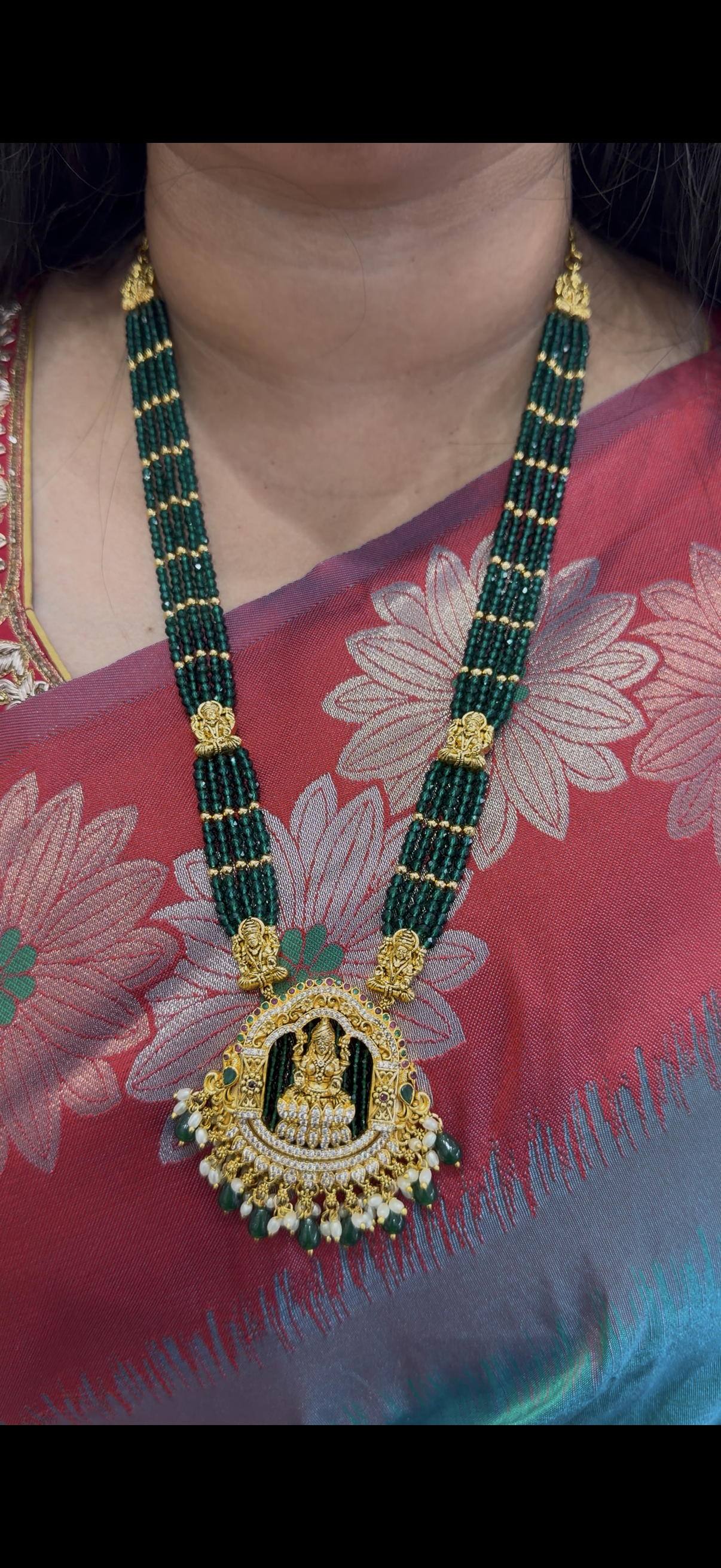 Beautiful  24inch green beads with god motive locket
