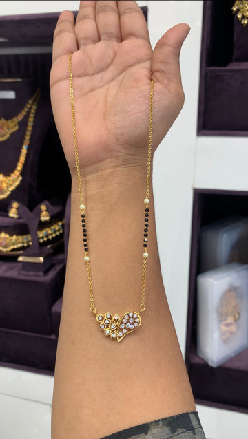 Beautiful white stone pendant with handmaking blackbeads & Chandraharam chain 18 inchs long