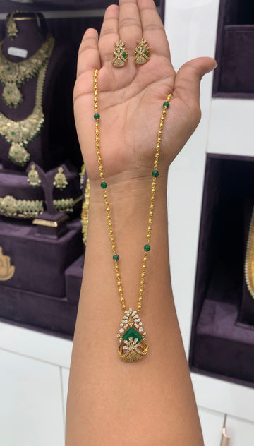 Beautiful green pendant set with gold balls chain 18 inchs long
