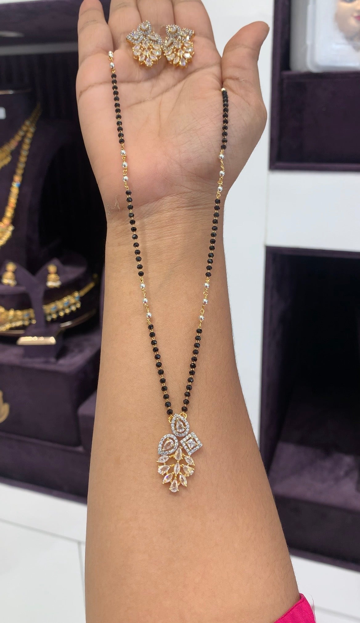 Beautiful white stone pendant set with Blackbeads chain 18 inchs long