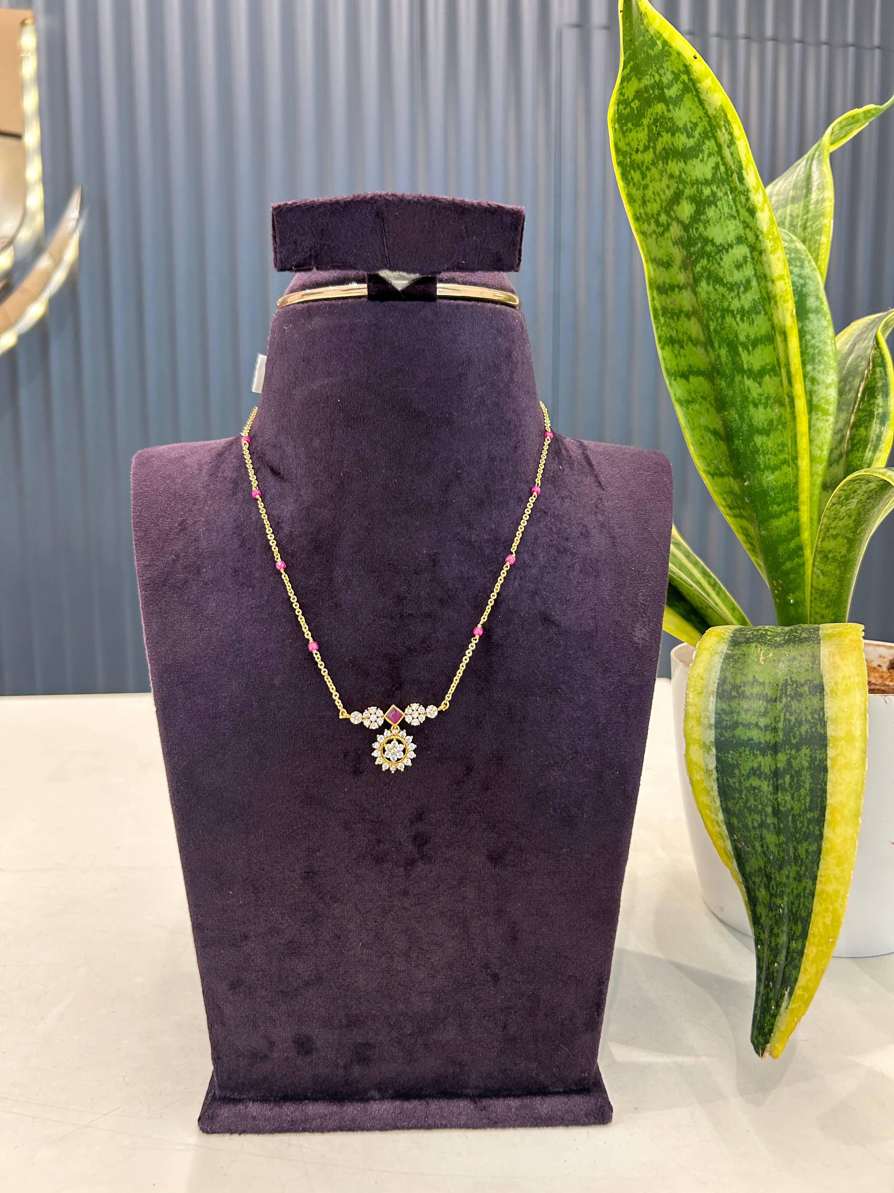 Beautiful white stone pendant with Chandraharam chain 18 inchs long