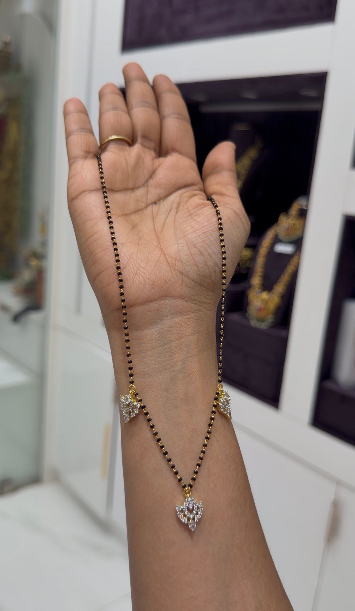 Beautiful simple white stone lockets with blackbeads chain 18 inchs long