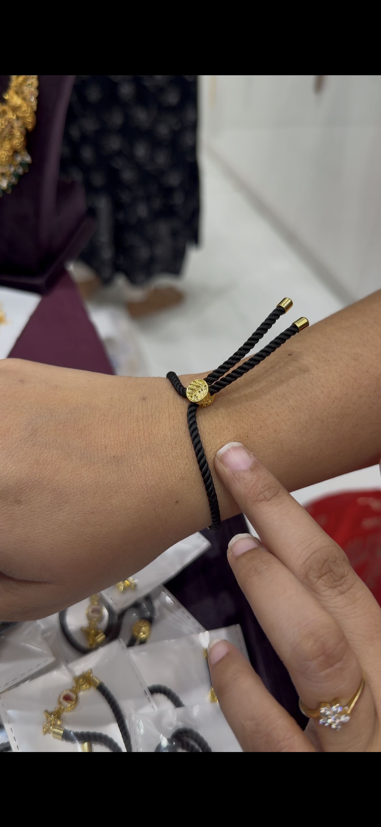 Black thread bracelet