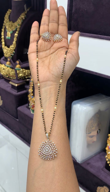 Beautiful white stone pendant set with Blackbeads chain 18 inchs long