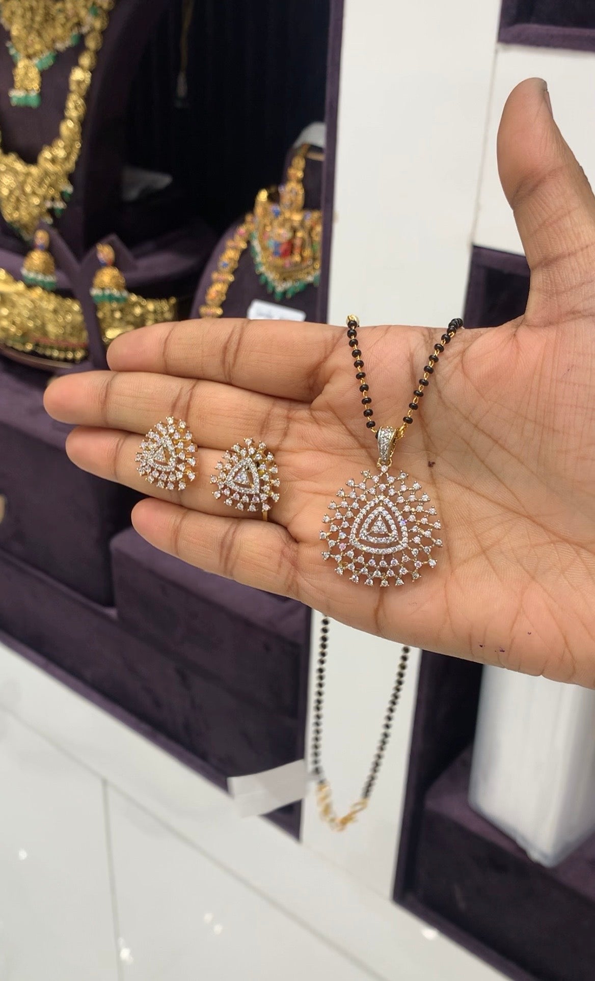 Beautiful white stone pendant set with Blackbeads chain 18 inchs long