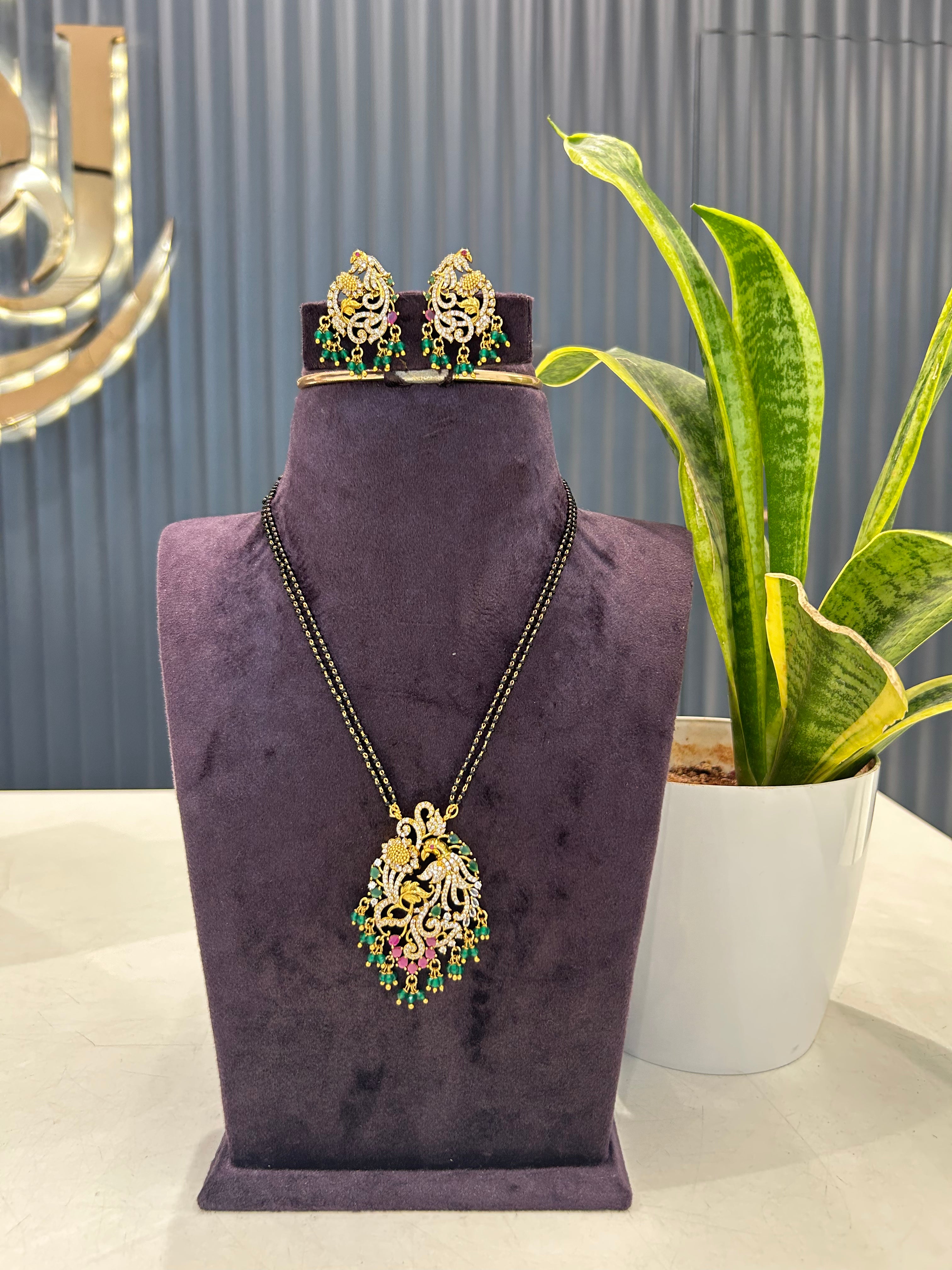 Beautiful peacock design pendant set with Blackbeads chain 18 inchs long