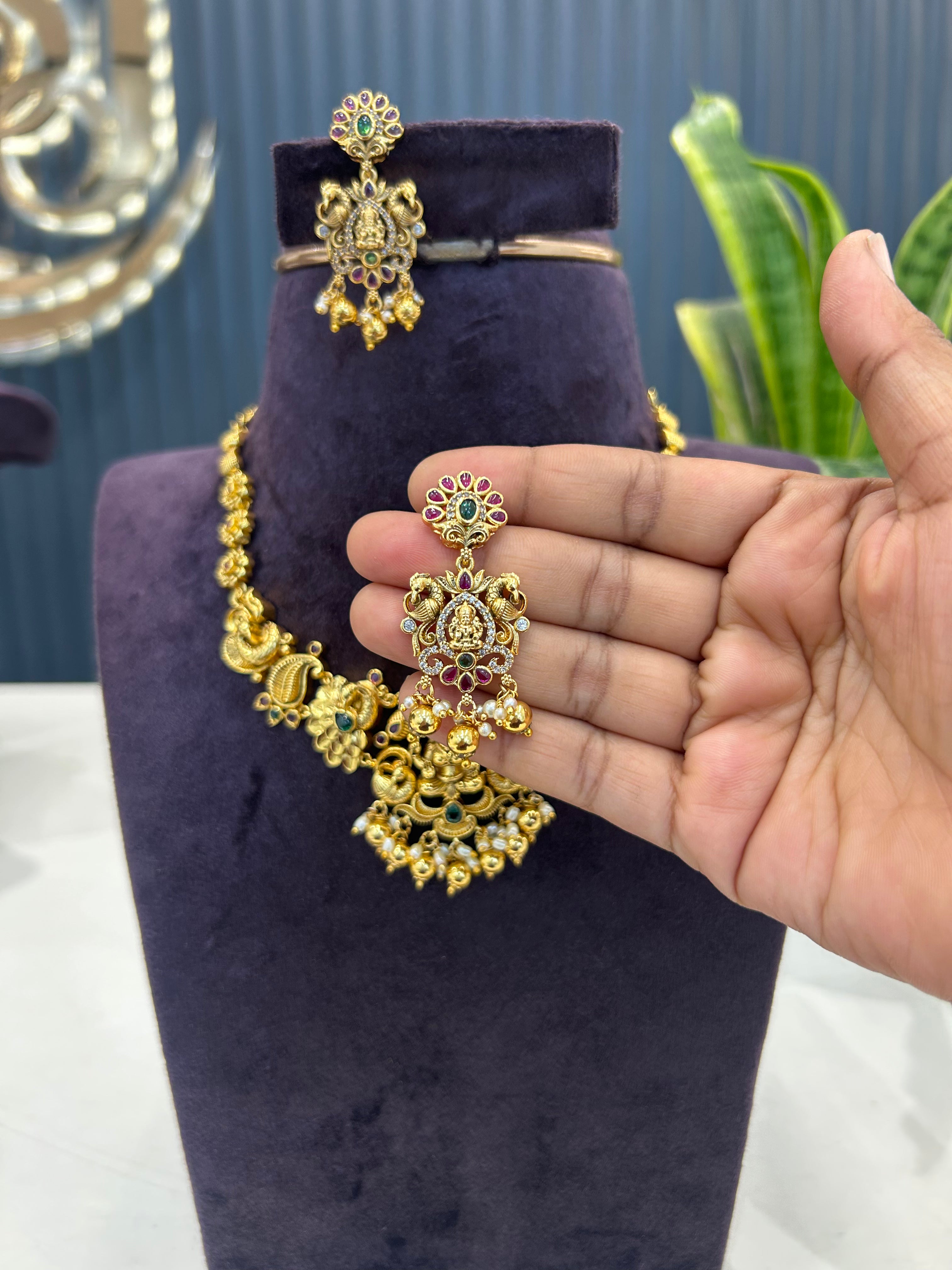 Beautiful Lakshmi devi peacock design embossing necklace with pushback ear hangings