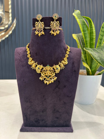 Beautiful Lakshmi devi peacock design embossing necklace with pushback ear hangings