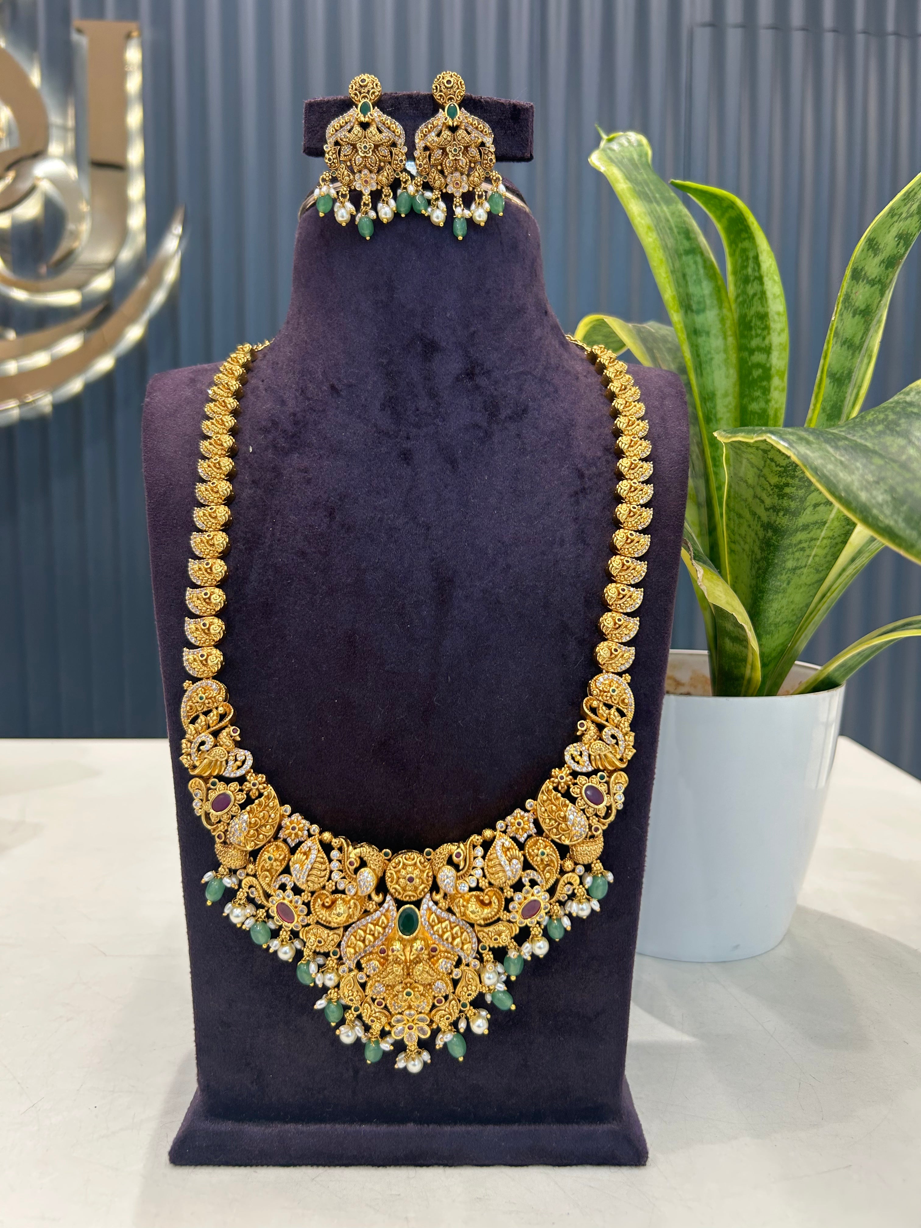 Beautiful CZ stone peacock design embossing haram with ear hangings