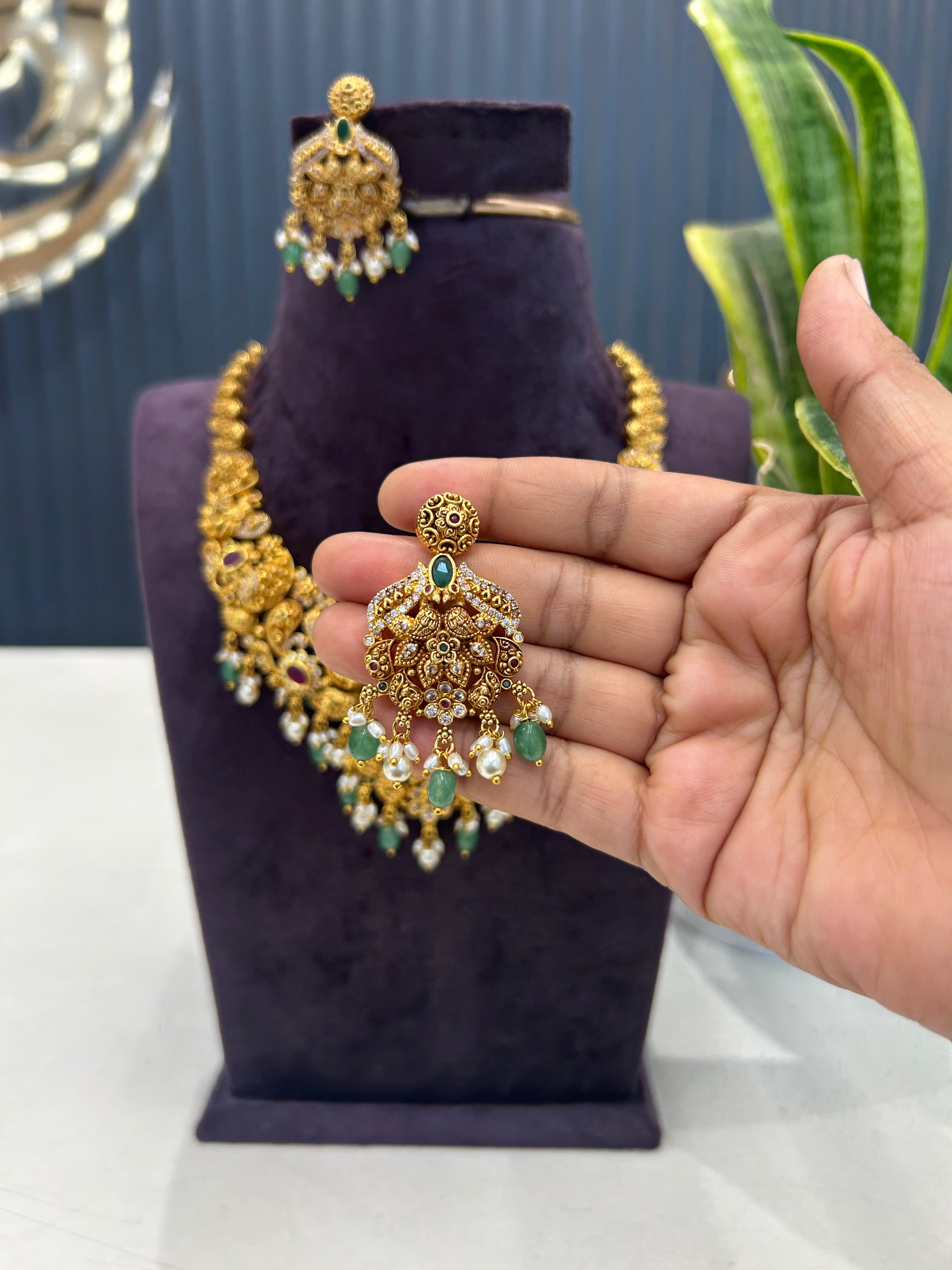 Beautiful peacock design embossing necklace with screwback ear hangings