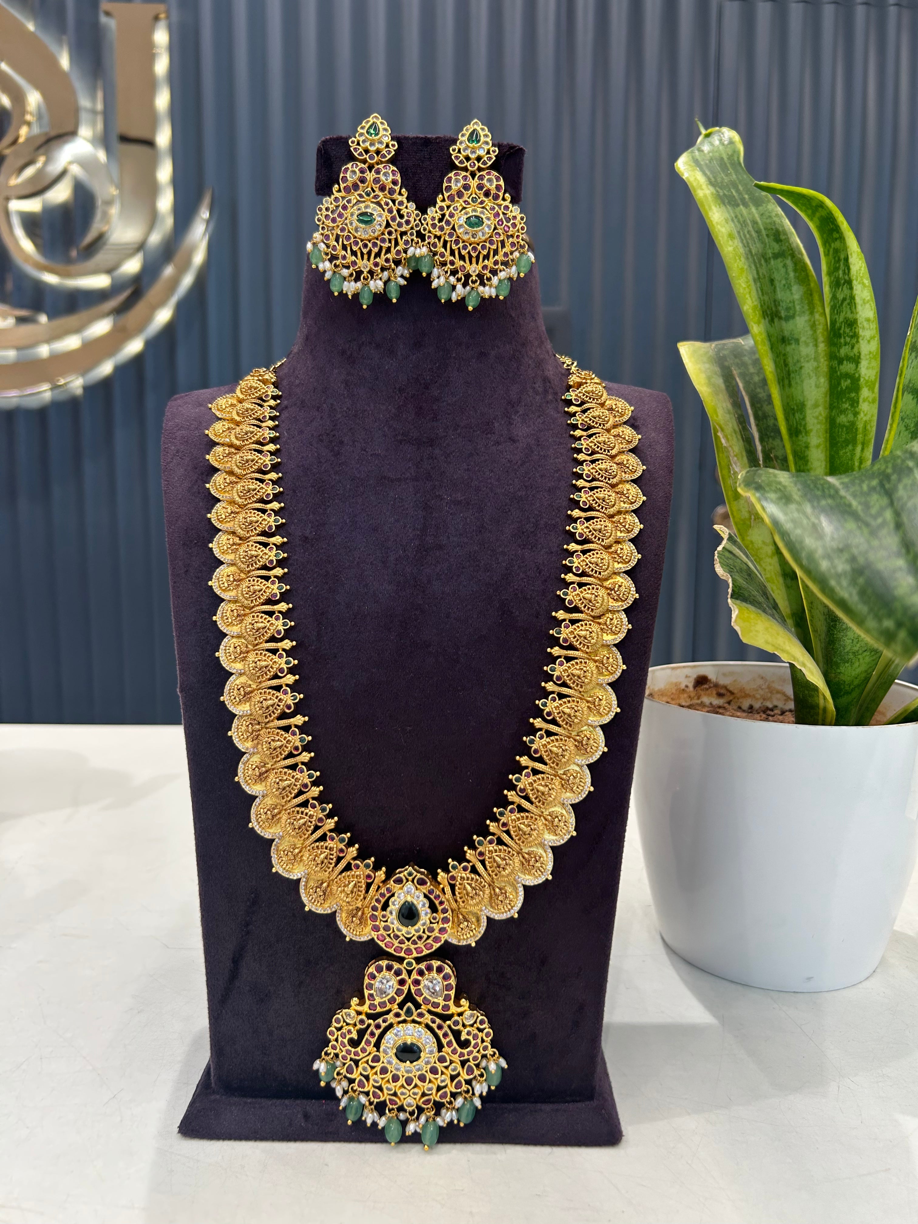 Beautiful pota stone kasula long haram with screwback ear hangings