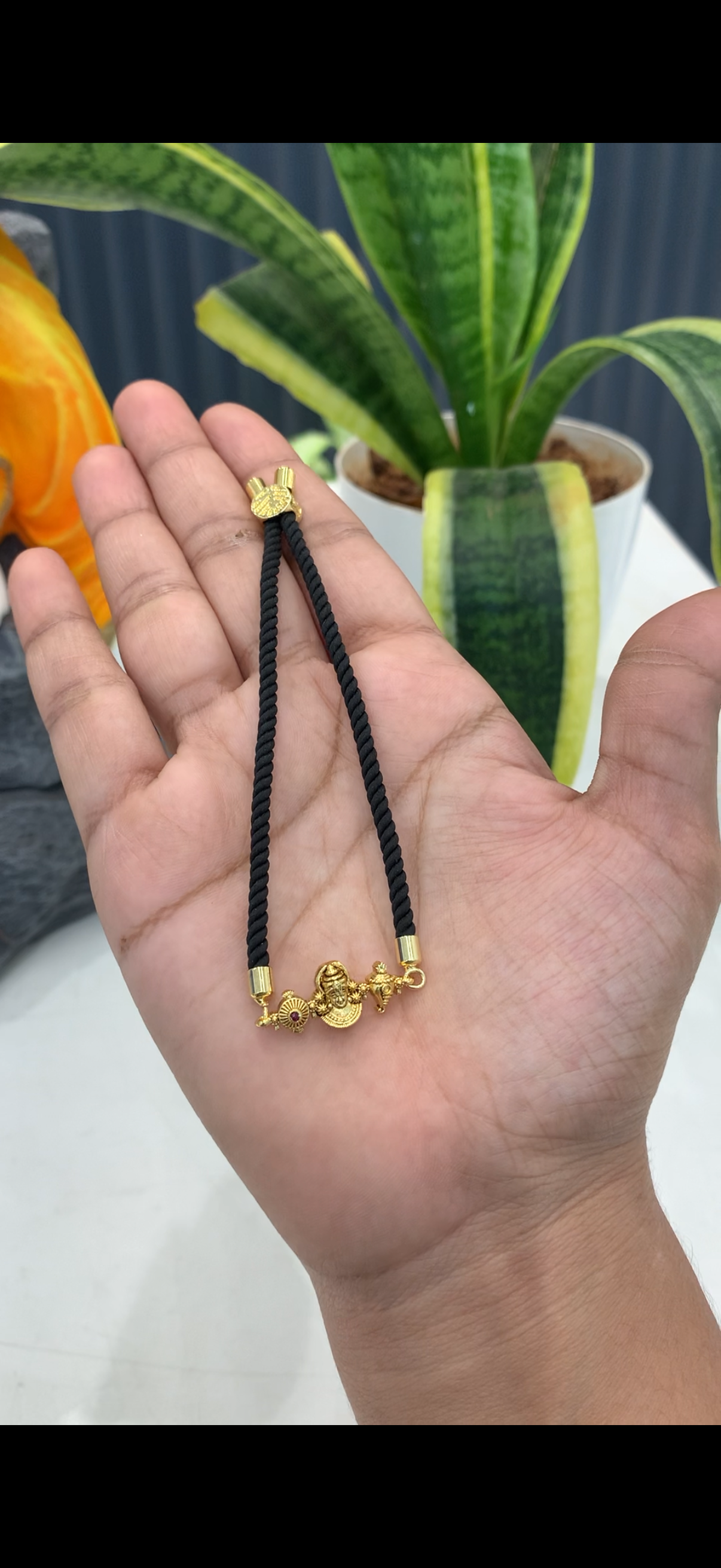 Black thread bracelet with Venkateswara swamy idol