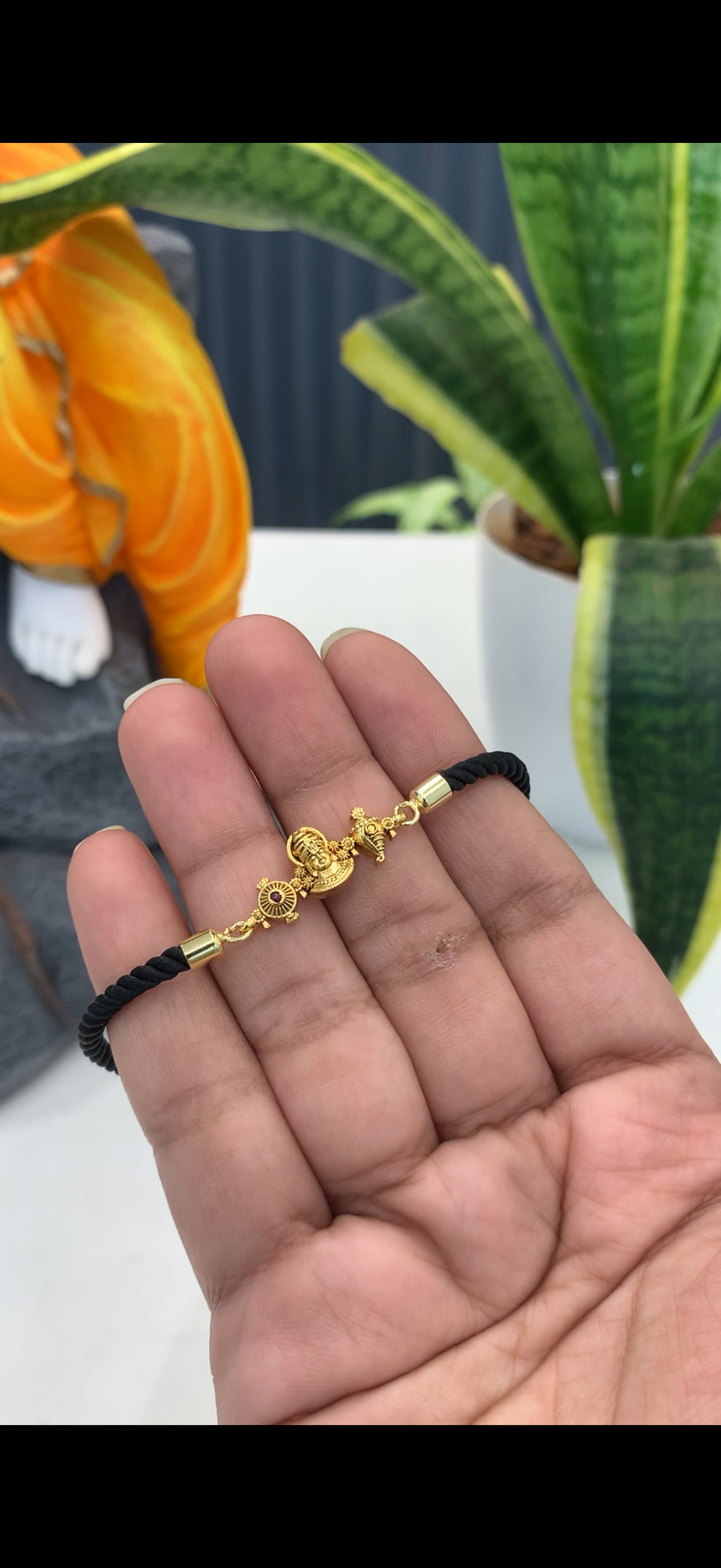 Black thread bracelet with Venkateswara swamy idol