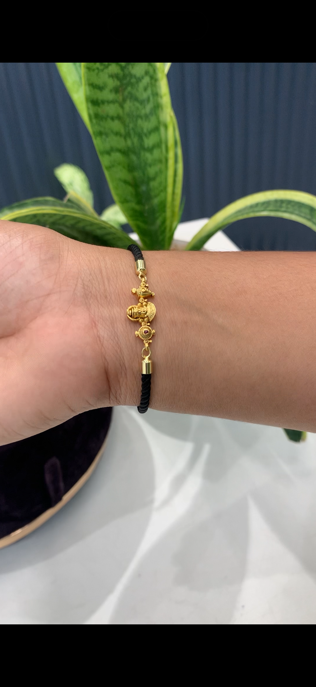 Black thread bracelet with Venkateswara swamy idol