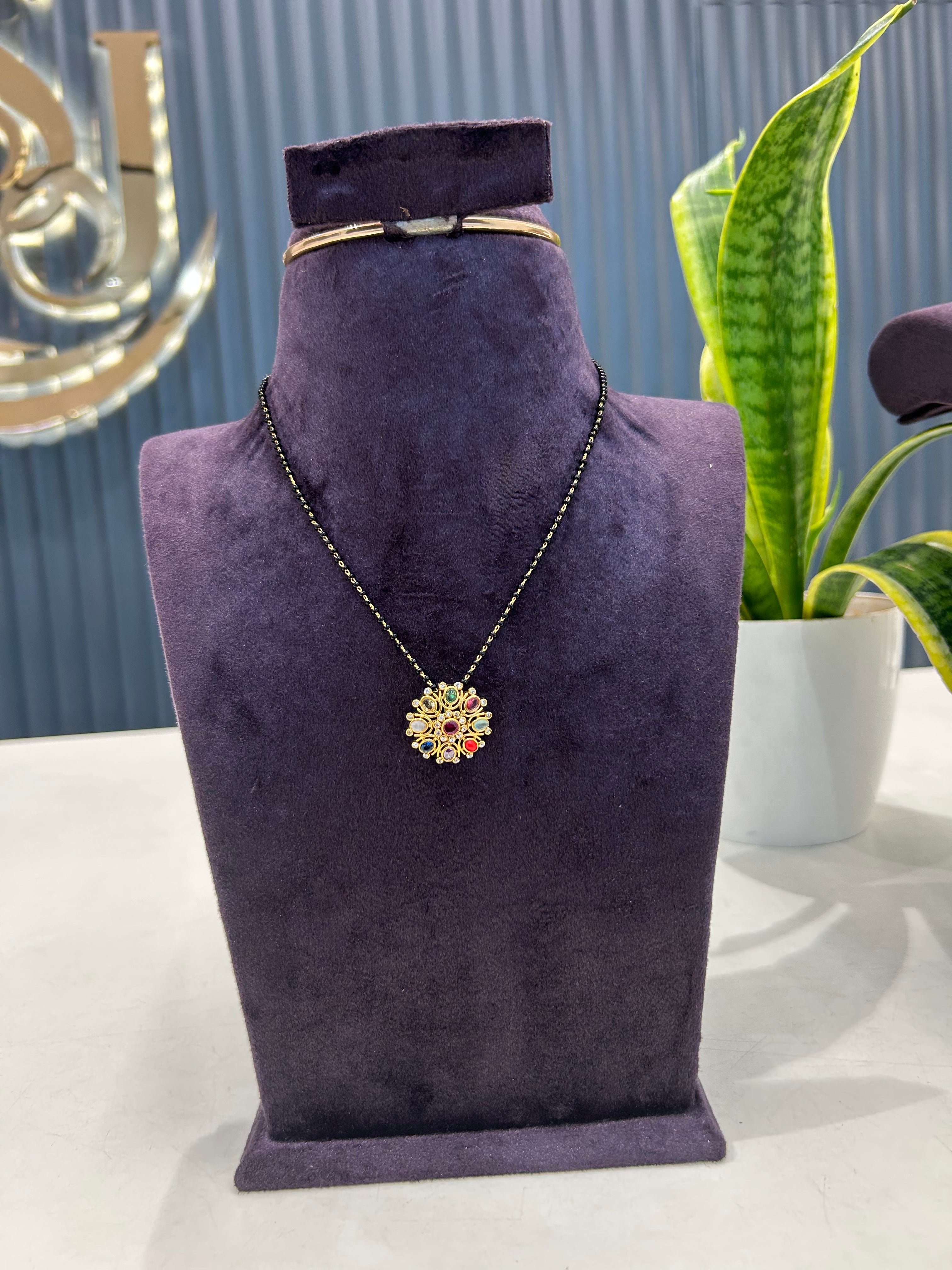 Beautiful navarathna locket with blackbeads chain 18 inchs long