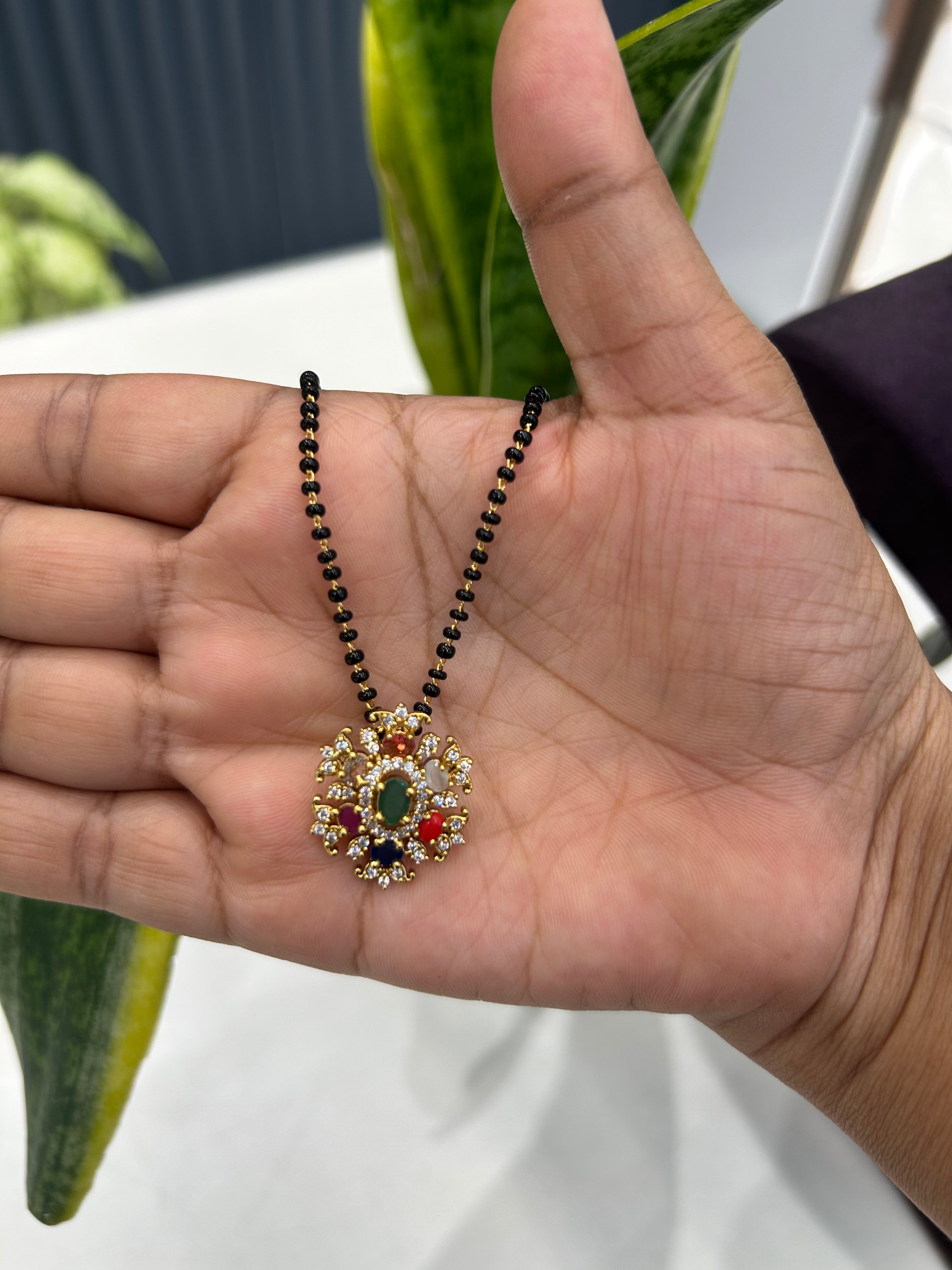 Beautiful navarathna locket blackbeads chain 18 inchs long