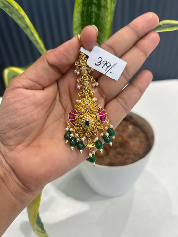 Beautiful jadau stone & peacock design tikka with green beads