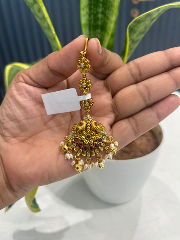 Beautiful peacock design tikka with gold balls