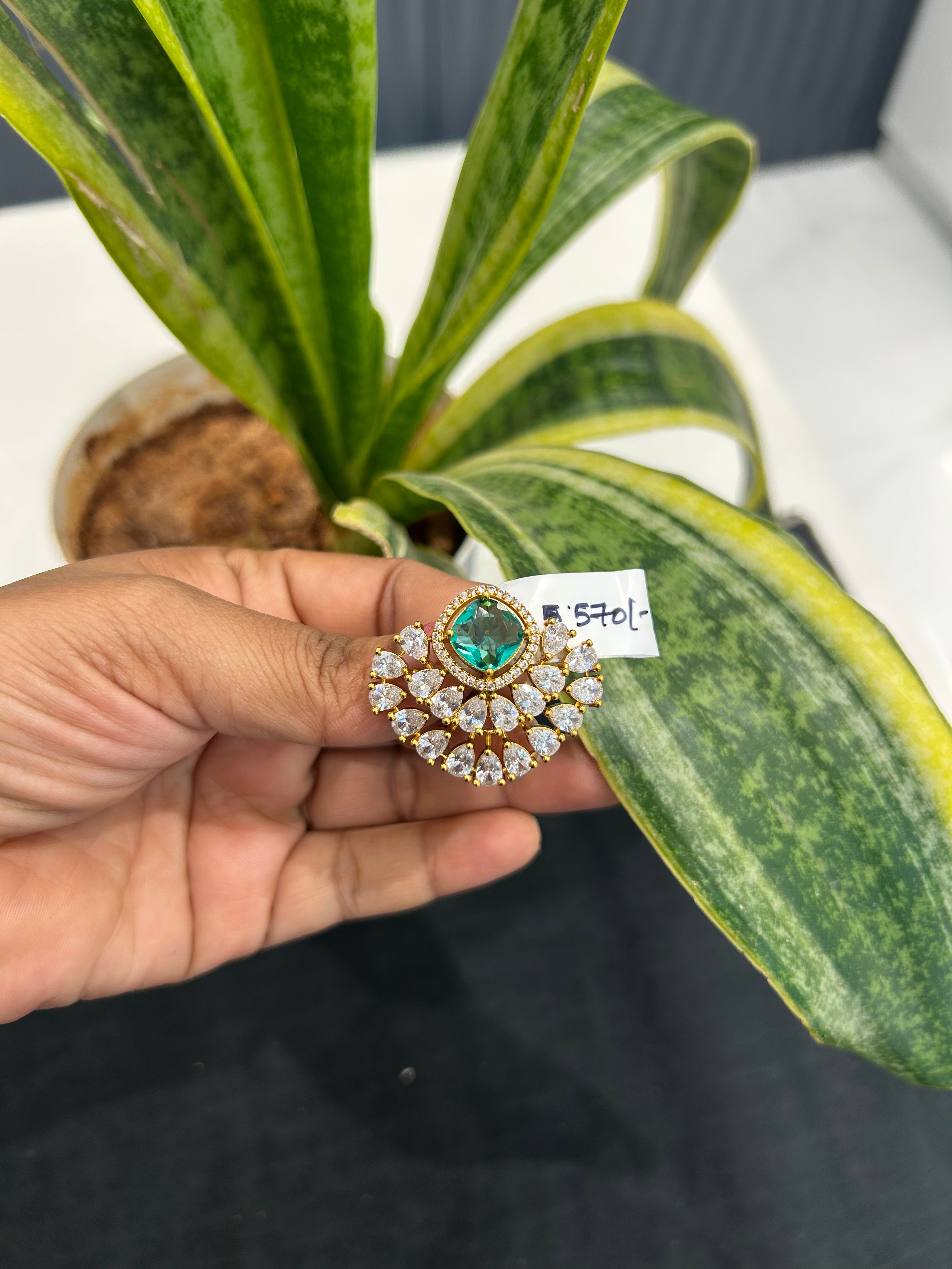 Beautiful green stone pendant set with backhook