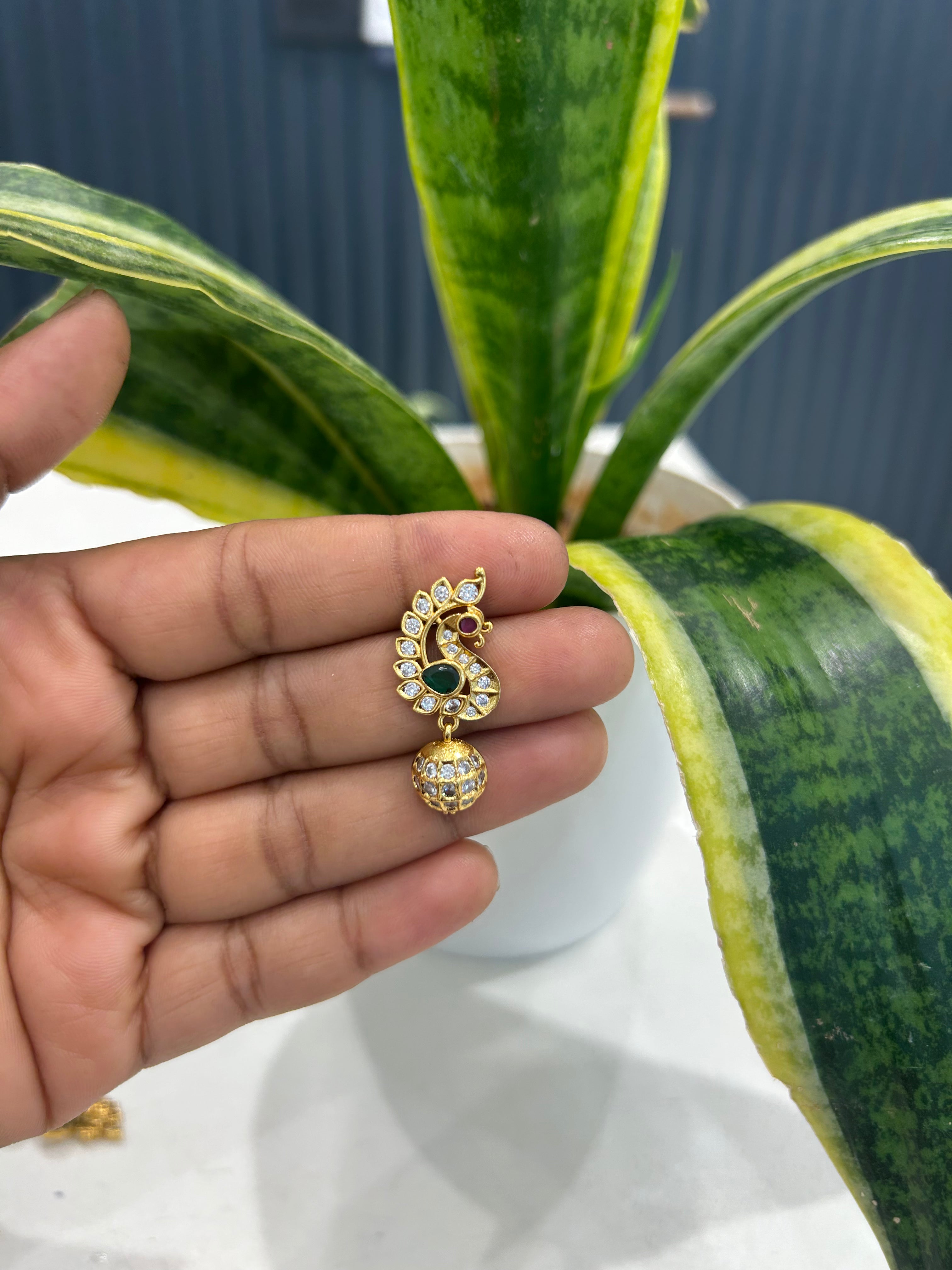 Beautiful uncut stone peacock design studs with pushback