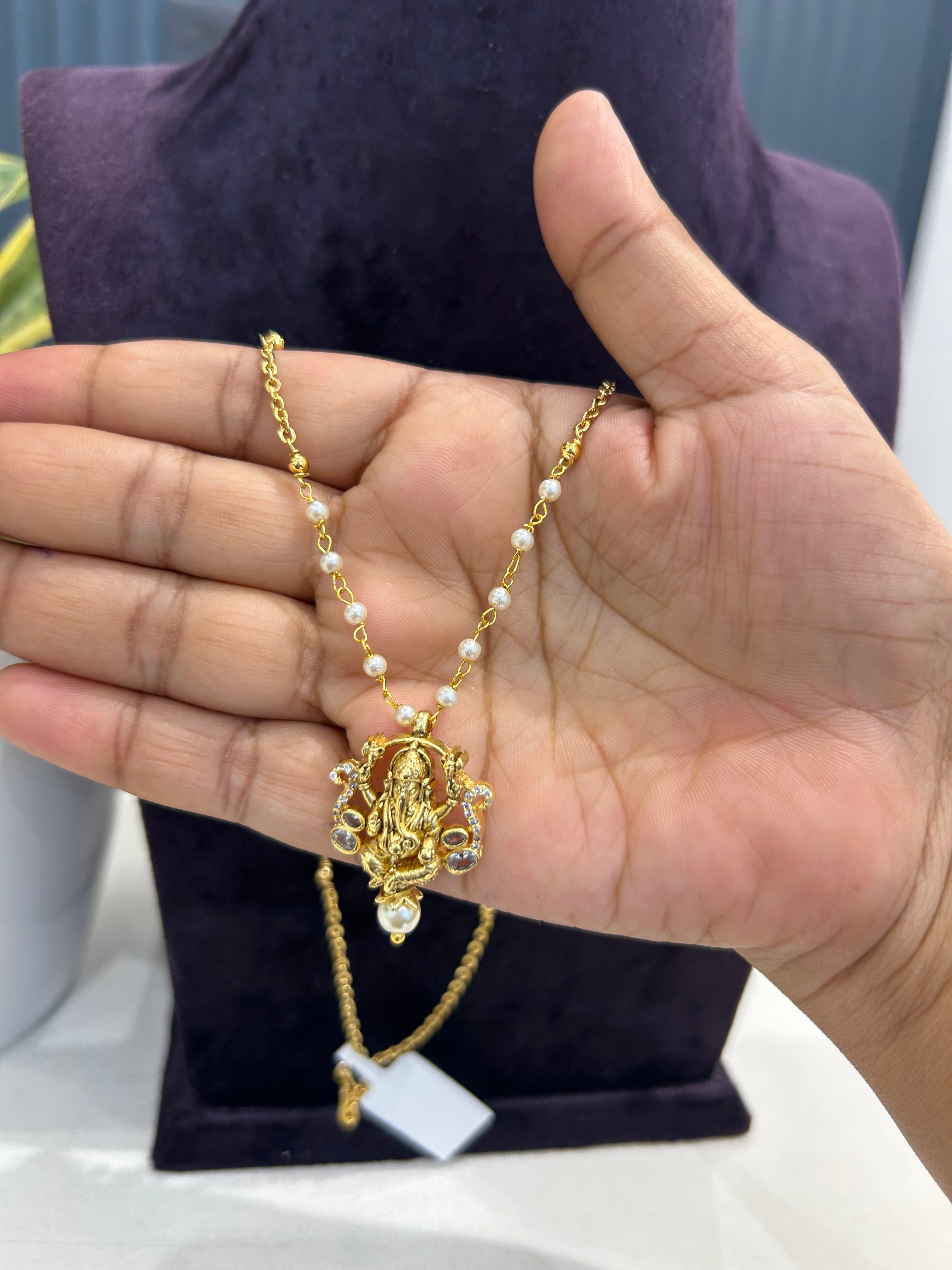 Beautiful ganesh pendent with handmaking pearls & chandraharam chain 18 inchs long
