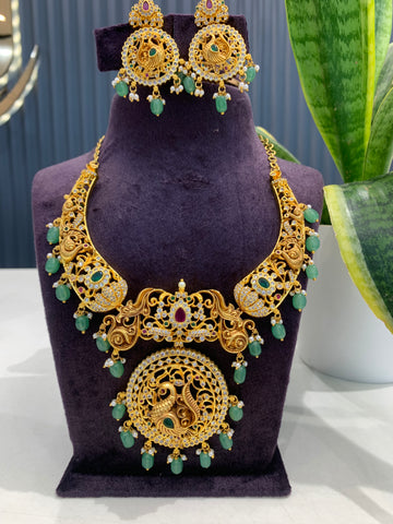 Beautiful peacock design kanti model necklace with screwback ear hangings
