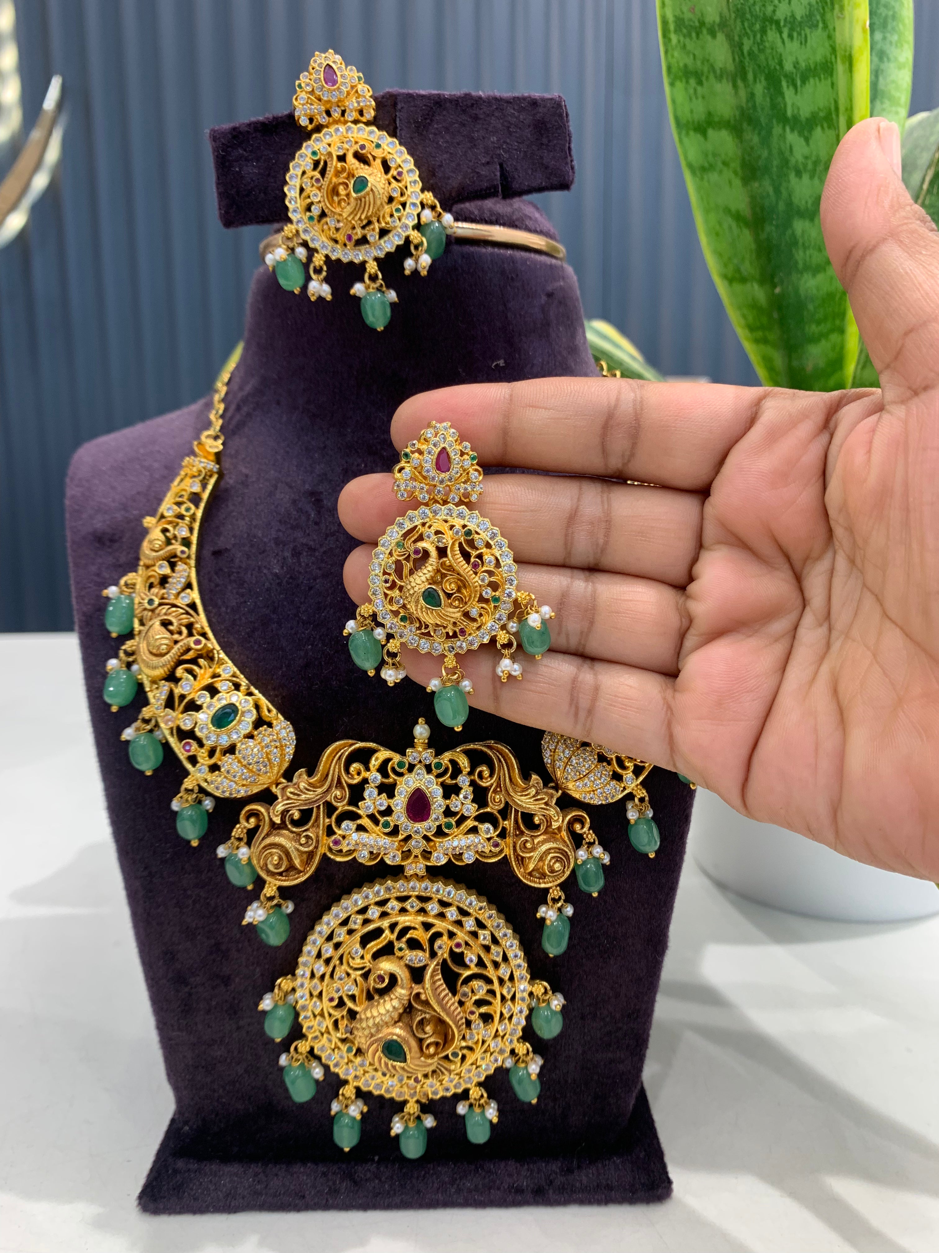 Beautiful peacock design kanti model necklace with screwback ear hangings