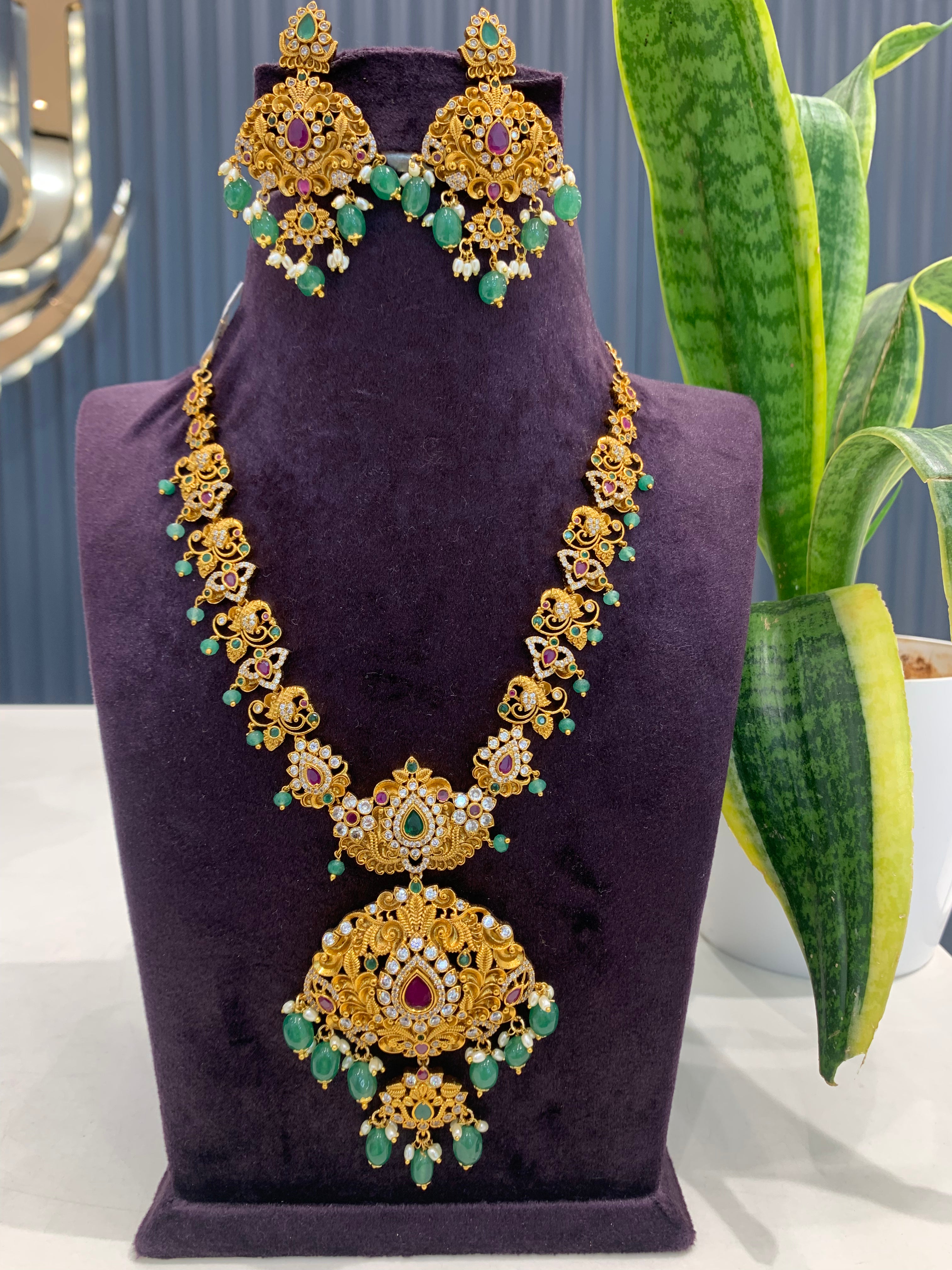 Beautiful CZ stones peacock design necklace with screwback ear hangings